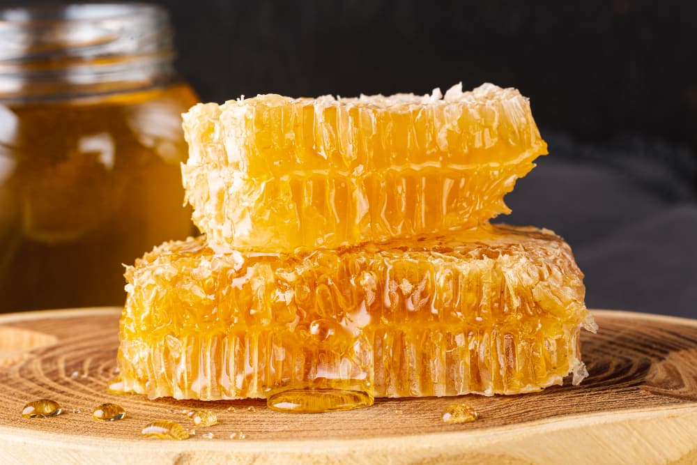 Honeycombs on a wooden platter